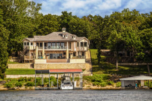 large lake house with boat dock